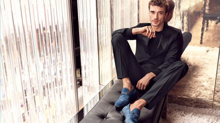 French model Clément Chabernaud wears suede loafers for Jimmy Choo's pre-fall 2018 campaign.