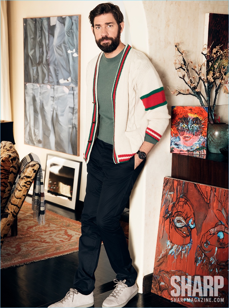 Actor John Krasinski wears a Gucci cardigan with a Louis Vuitton sweater and pants. He also sports Kenneth Cole sneakers and a Montblanc watch.