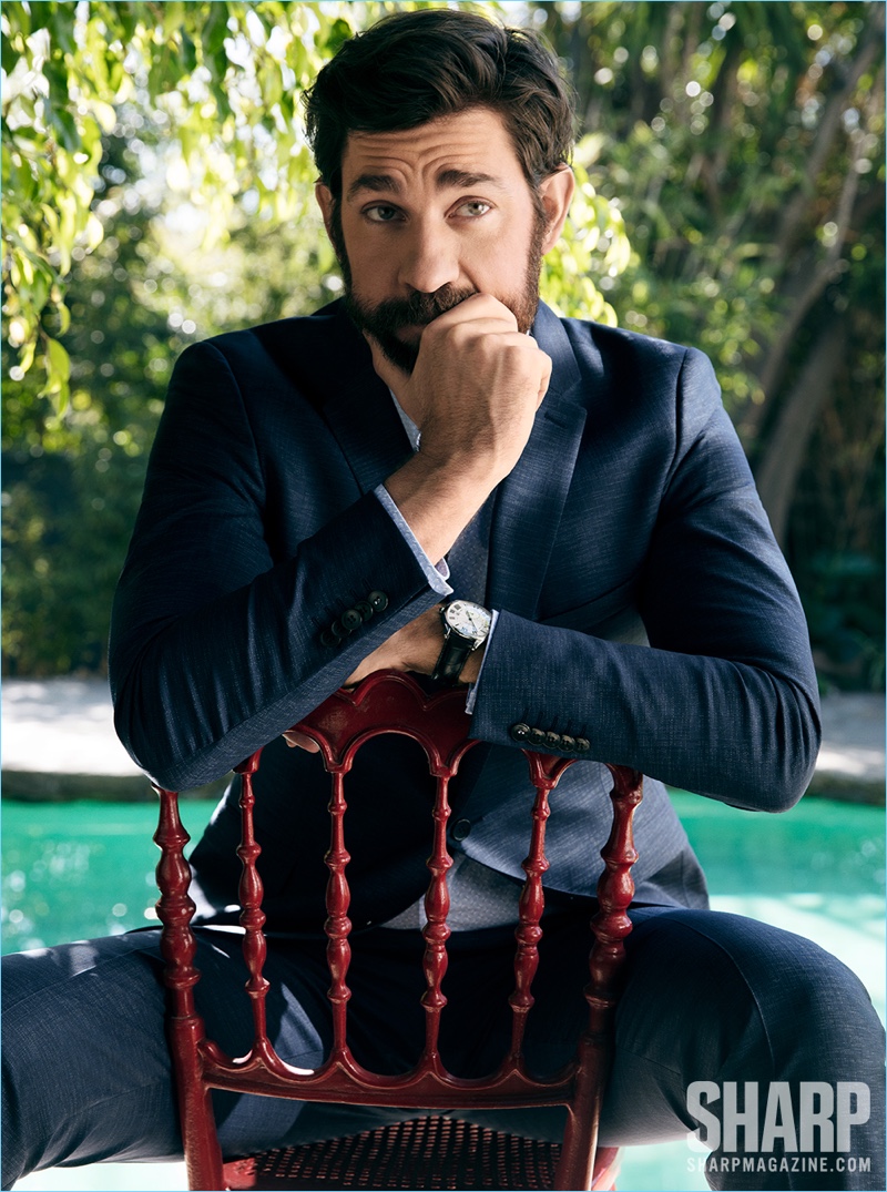 Starring in a new photo shoot, John Krasinski wears a Strellson shirt and suit with a Cartier watch.