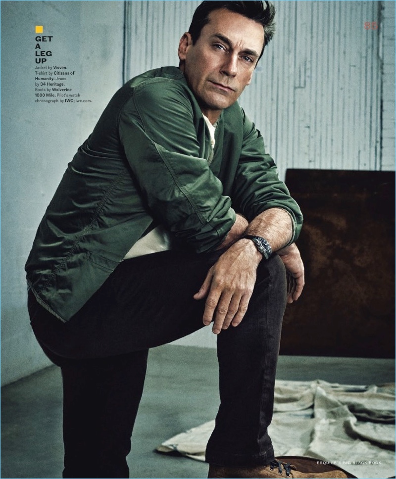 Connecting with Esquire Big Black Book, Jon Hamm wears a Visvim bomber jacket. He also sports a Citizens of Humanity t-shirt, 34 Heritage jeans, and Wolverine 1000 Mile boots. A watch by IWC completes his look.
