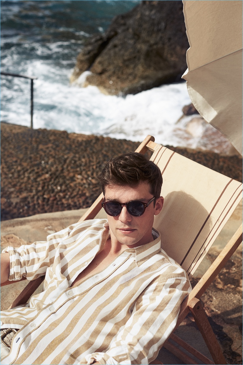 French model Alexis Petit lounges as the star of Mango Man's high summer 2018 campaign.