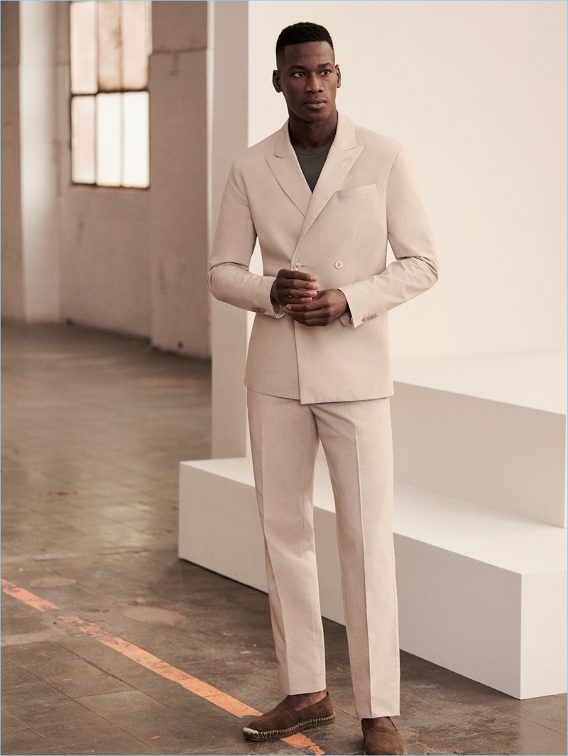 David Agbodji is a sharp vision in a neutral double-breasted suit by Mango Man.