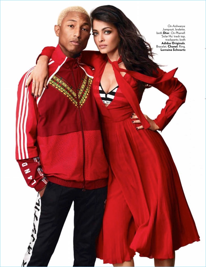 Posing with Aishwarya Rai Bachchan, Pharrell Williams wears an Adidas Originals tracksuit.