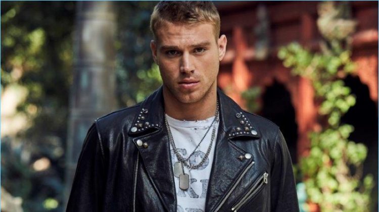 Channeling his inner bad boy, Matthew Noszka rocks a leather biker jacket and denim from Replay Jeans.