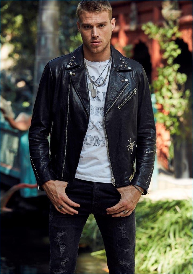 Channeling his inner bad boy, Matthew Noszka rocks a leather biker jacket and denim from Replay Jeans.