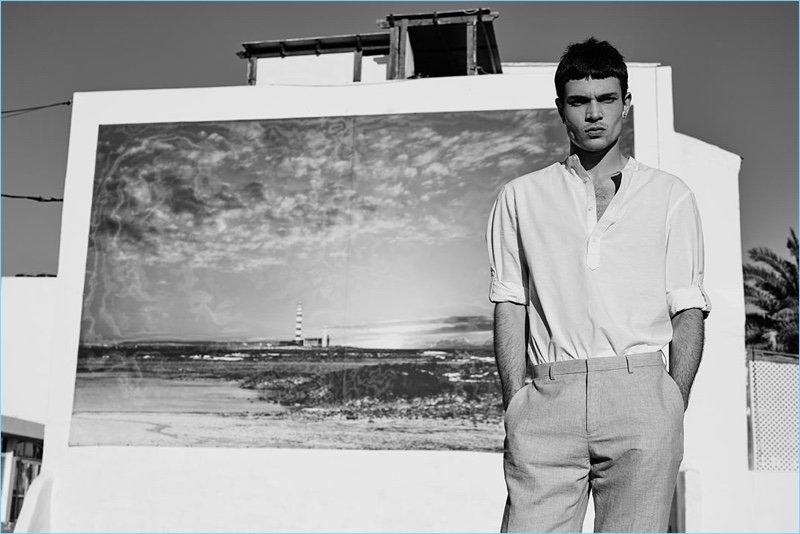 Appearing in a black and white image, Luka Isaac wears a summer look from Reserved.