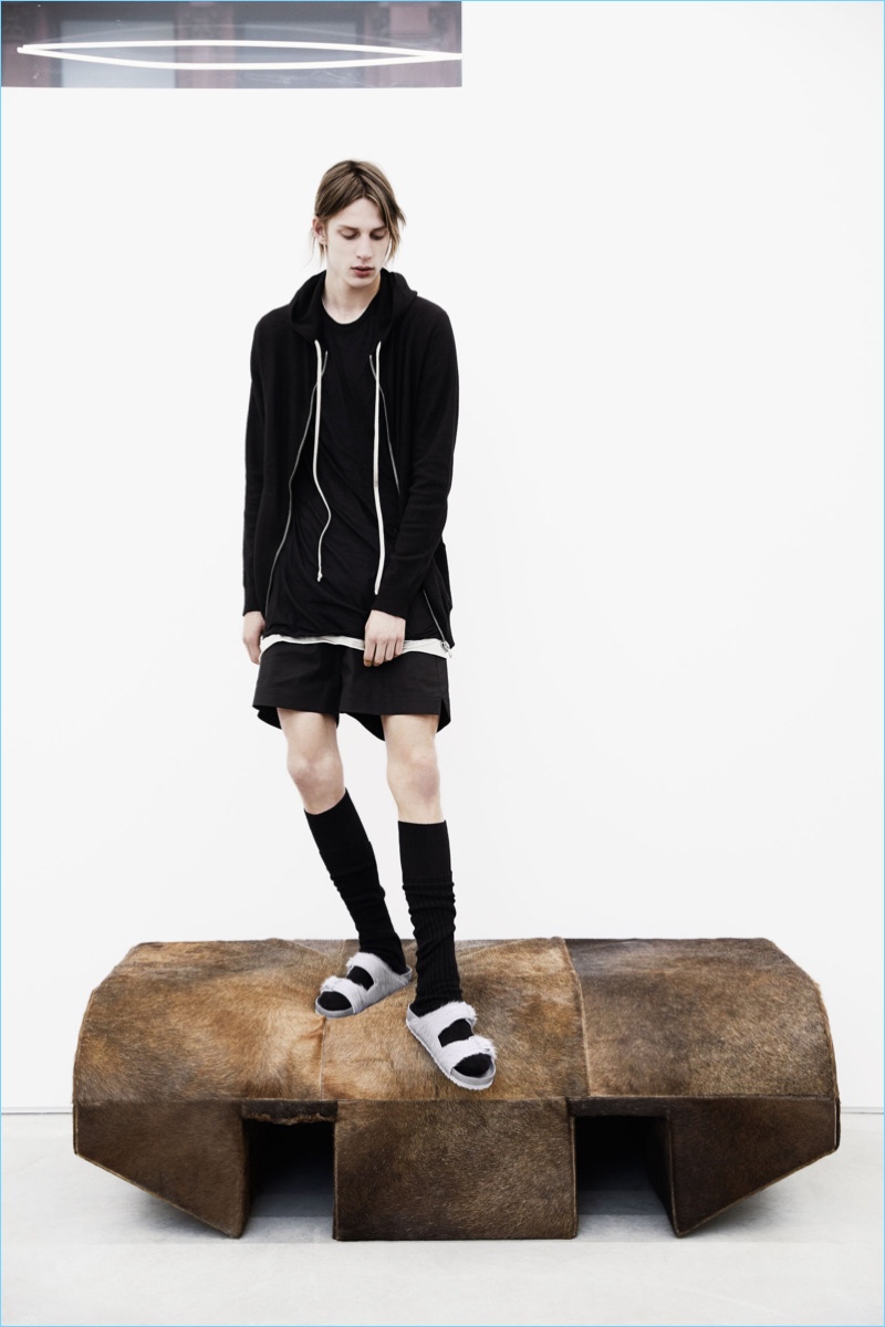 Model Chris Stelczer sports Rick Owens x Birkenstock socks and fur sandals.