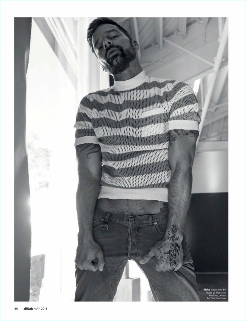 Sporting a mesh Prada top, Ricky Martin also wears Dior Homme jeans.