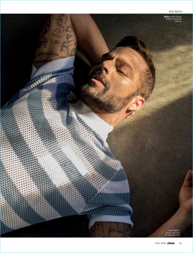 Starring in a photo shoot, Ricky Martin wears a striped mesh top by Prada.