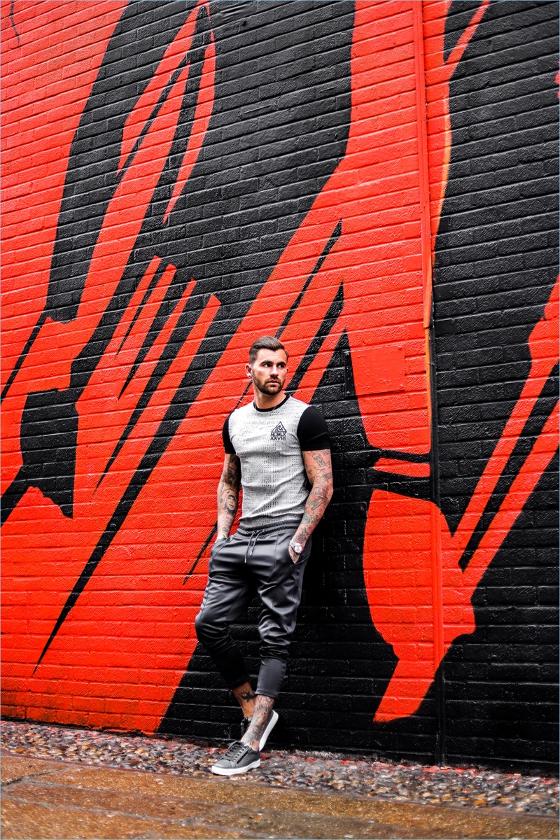 Chris Perceval wears a muscle-fit t-shirt with joggers from River Island's Concept collection. 