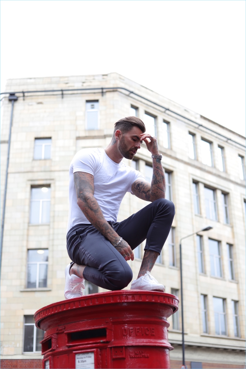 Model Chris Perceval wears a t-shirt and joggers from River Island's Concept collection.