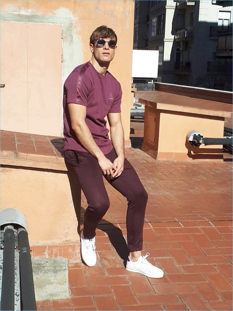 Elliot Reeder wears a slim-fit t-shirt and joggers from River Island's Concept collection.