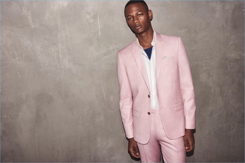 Lucas Cristino stands out in a pink suit from River Island.