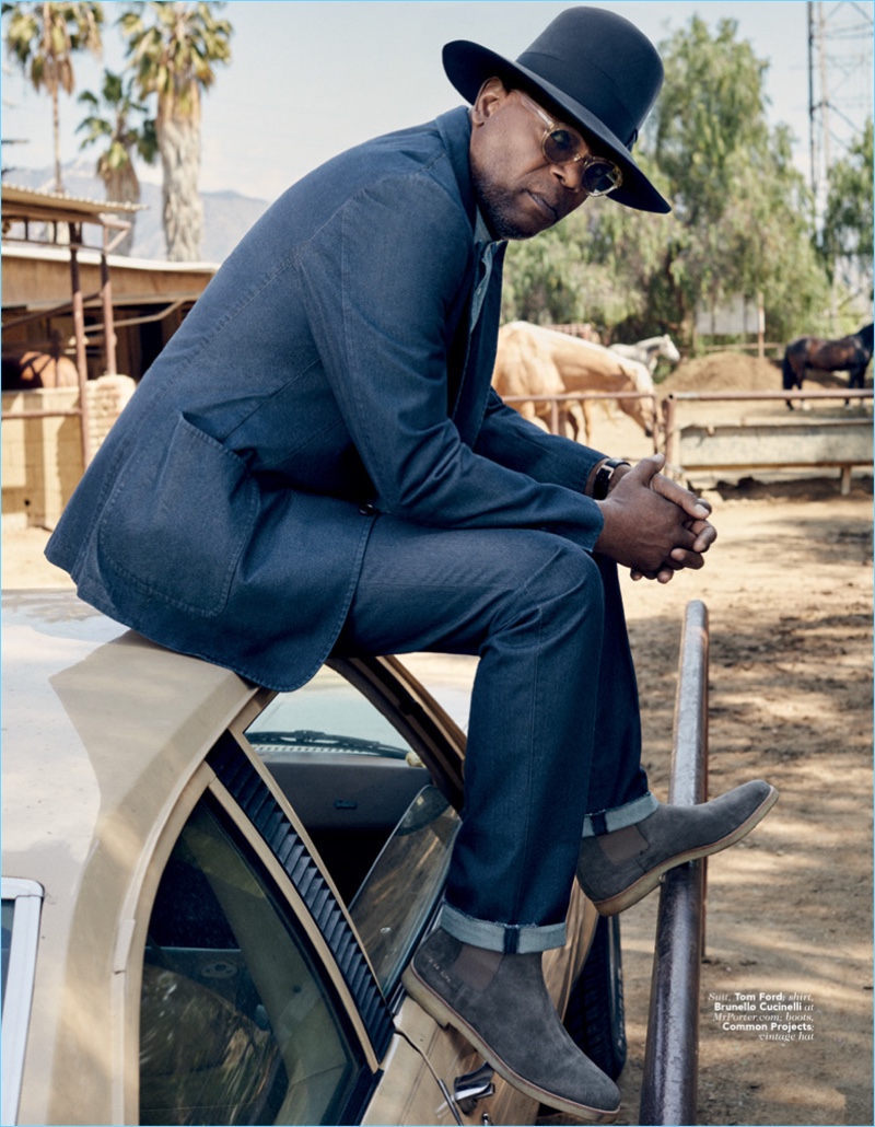 A cool vision, Samuel L. Jackson wears a Tom Ford suit with a Brunello Cucinelli shirt. He also rocks Common Projects boots and a vintage hat.