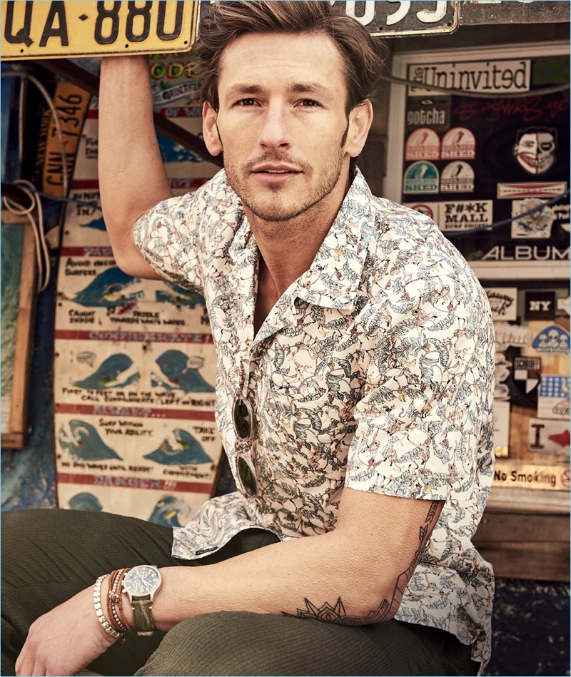 Ready for summer, Parker Gregory wears a Todd Snyder short-sleeve Liberty print treetop camp collar shirt.