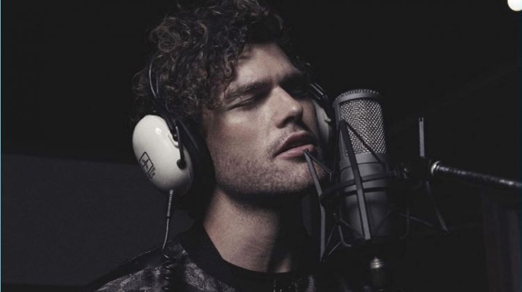 Taking to the studio, Vance Joy wears a bomber and tee by Emporio Armani.