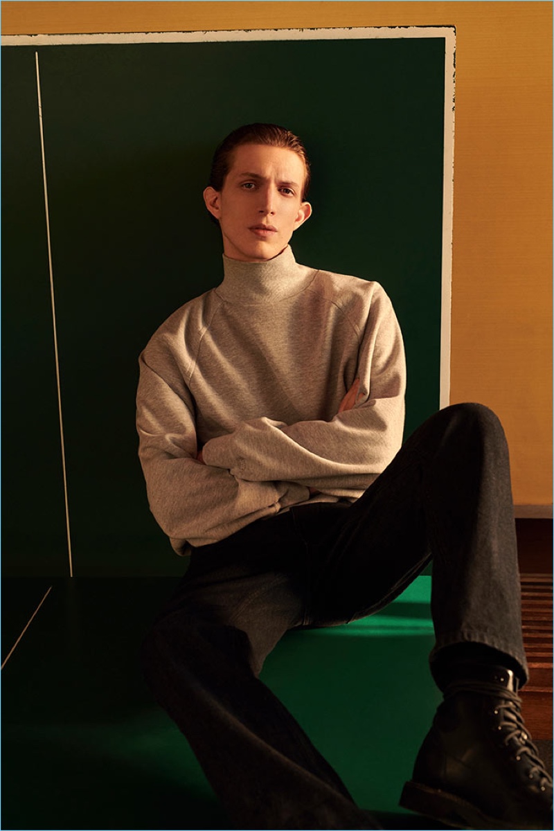 A chic vision, Xavier Buestel wears a turtleneck and jeans from Reserved's Re.Design.02 collection.