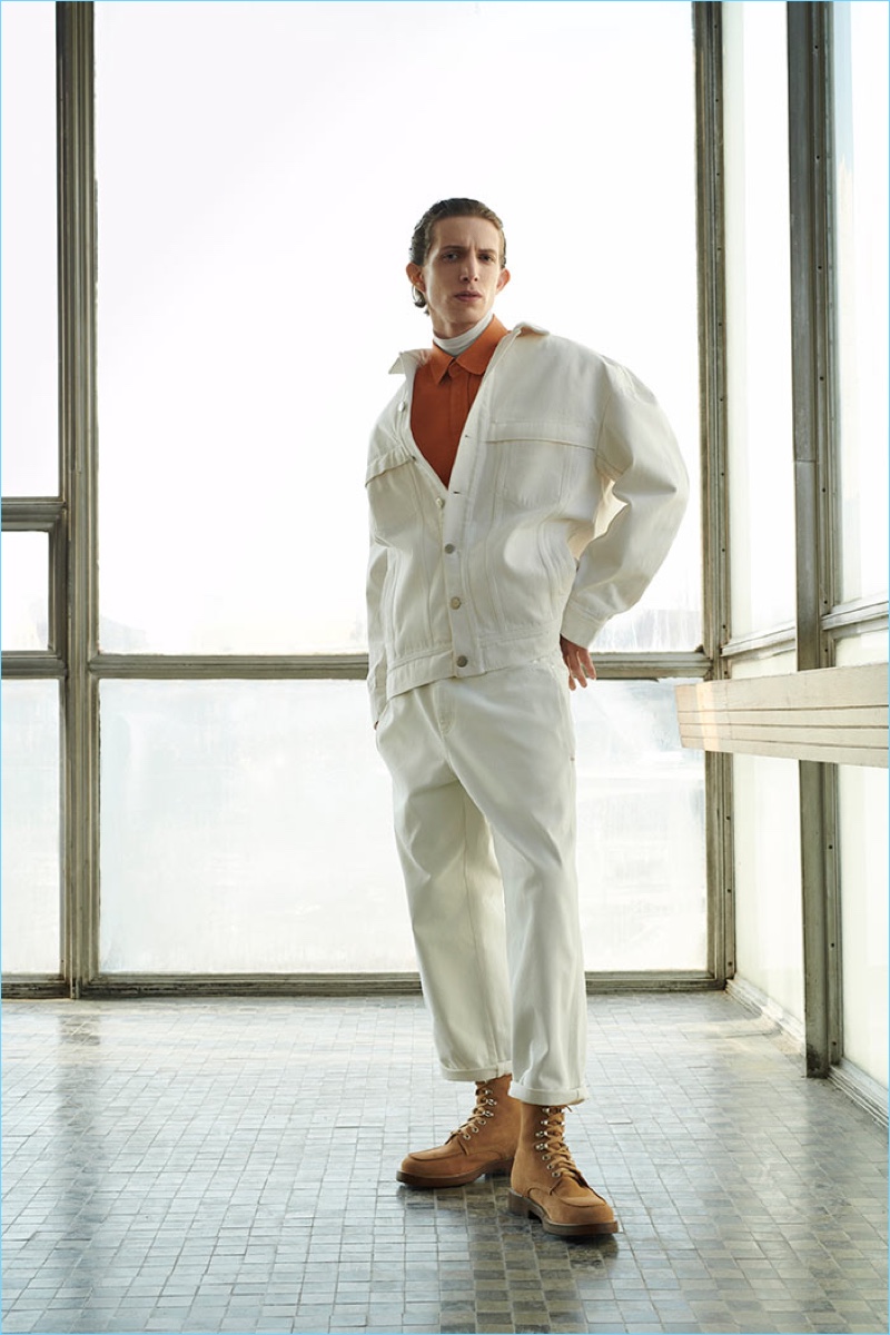 Rocking oversized white denim, Xavier Buestel wears a look from Reserved's Re.Design.02 collection.