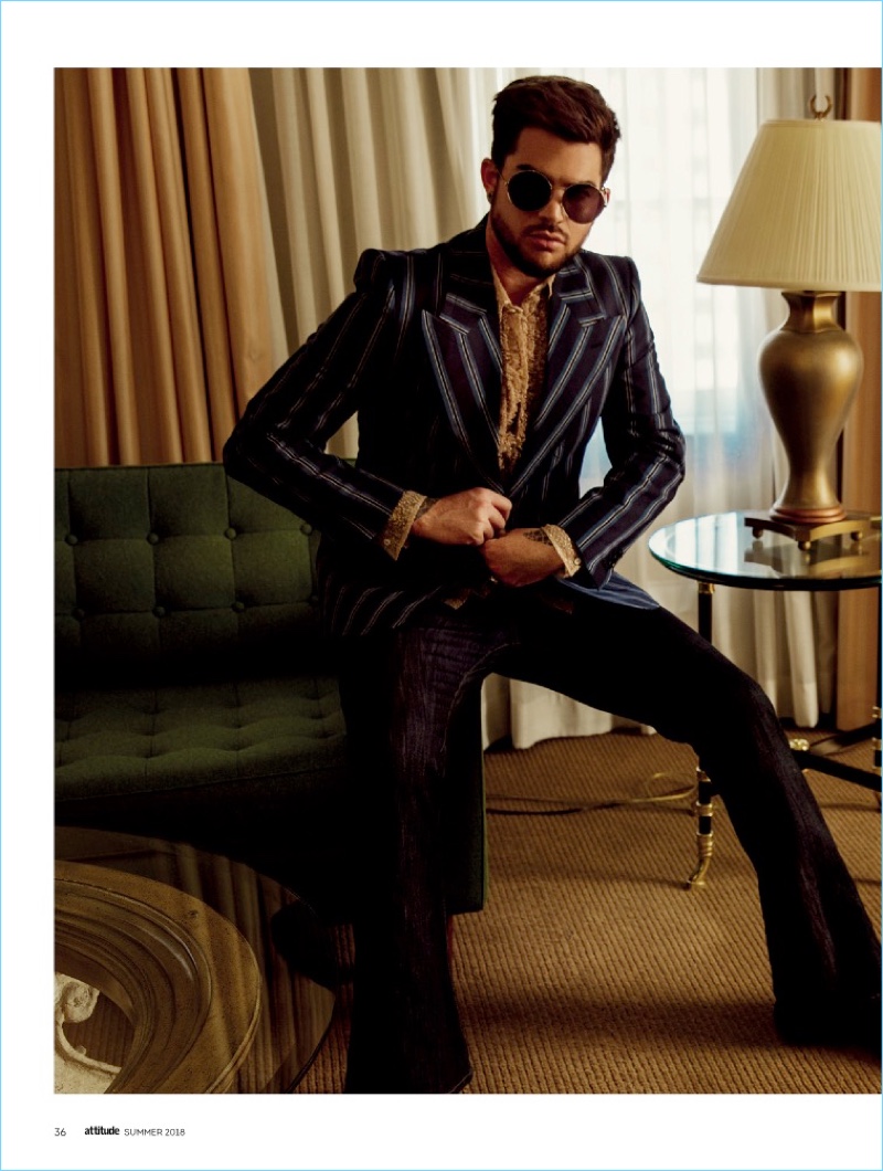 Singer Adam Lambert sports a March Jacobs blazer, Dsquared2 shirt, Madcap trousers, and Haider Ackermann boots.