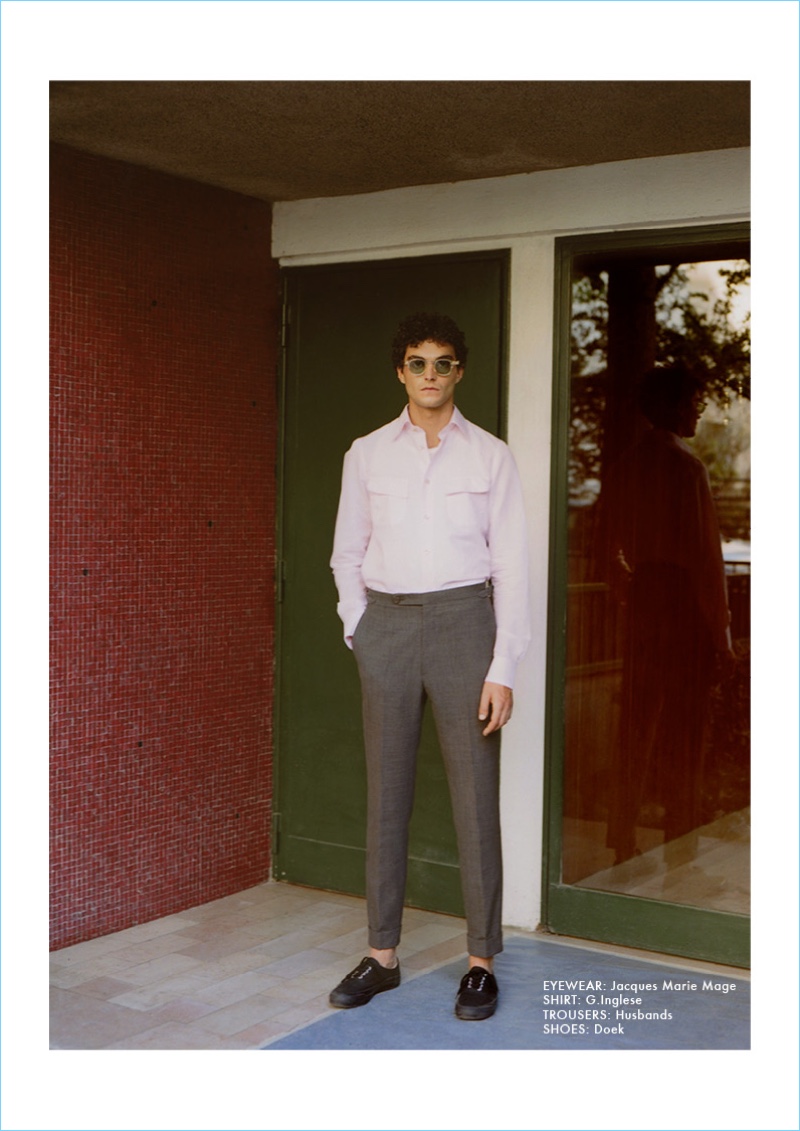 Making a timeless style proposal, Dylan Ézékiel Nelson wears a G. Inglese shirt, Husbands trousers, Doek shoes, and Jacques Marie Mage sunglasses.