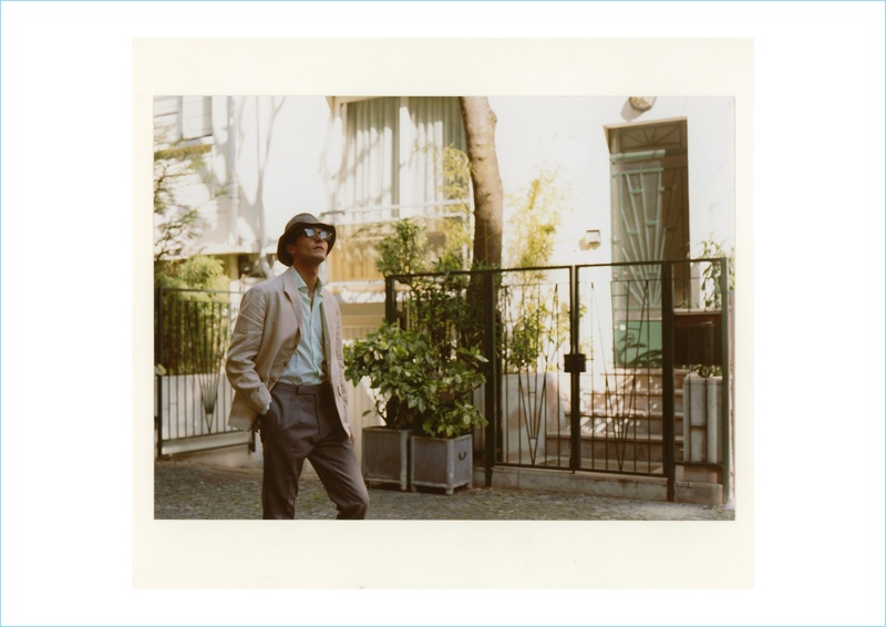 Starring in BEIGE's spring-summer 2018 lookbook, Dylan Ézékiel Nelson wears Julius Tart glasses and a Lock & Co. bucket hat. The Rock Men model also sports a Justo Gimeno jacket, G. Inglese shirt, and Camoshita pants.