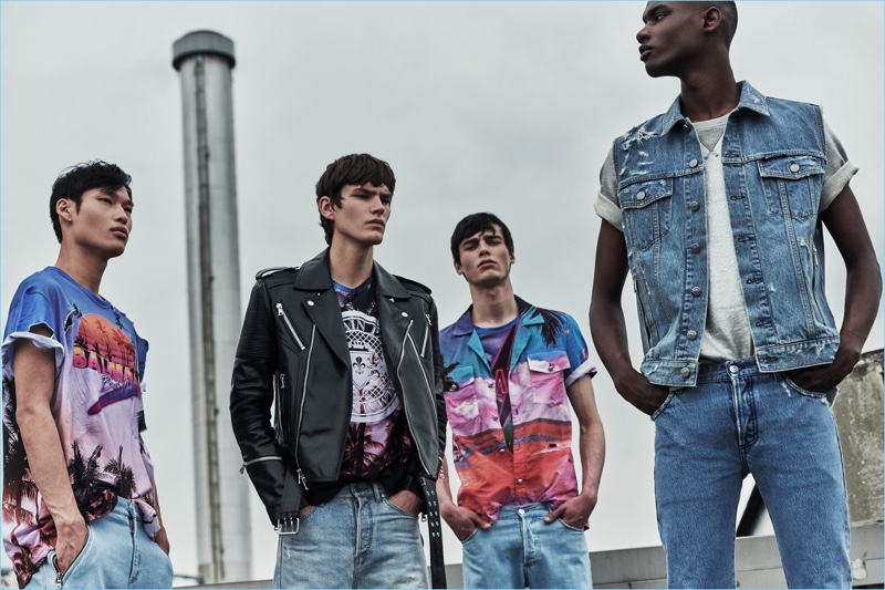 Chun Soot, Elias de Poot, Oussama Guessoum, and Rachide Embalo rock denim and tropical print fashions from Balmain.