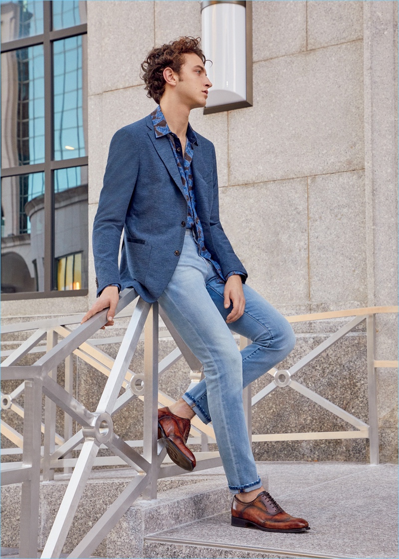 Niels Trispel dons a Luciano Barbera two-button sportcoat, Marco Pescarolo jeans, and Harris leather shoes. 