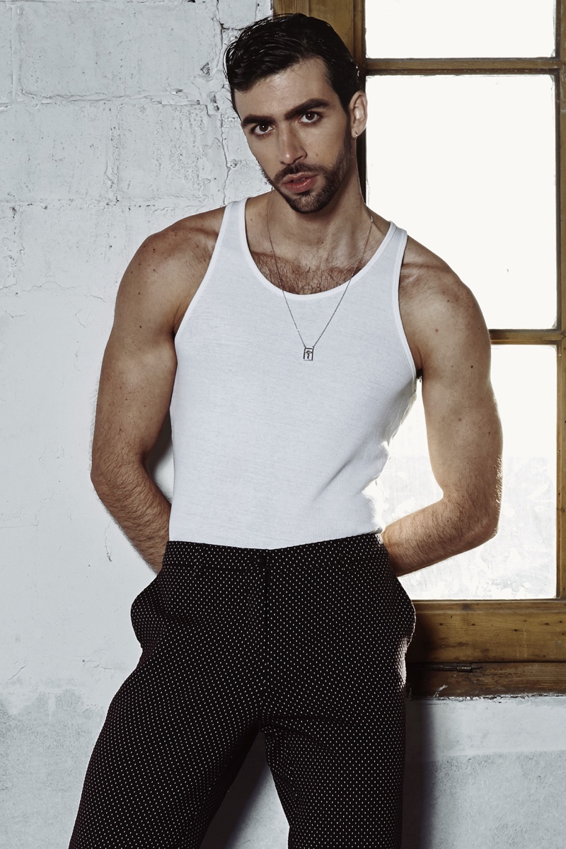 Carlos wears tank Dolce & Gabbana, pants Etro, and necklace Dueros Barcelona.