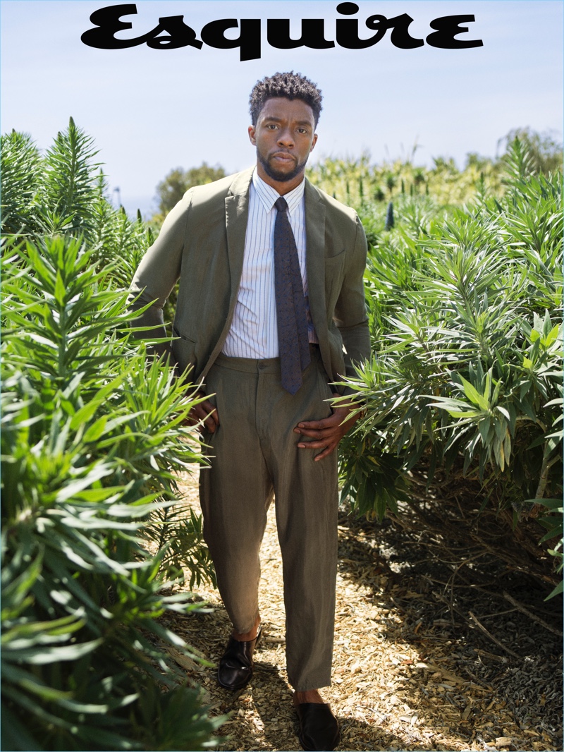 Sporting relaxed tailoring, Chadwick Boseman dons a suit, shirt, and tie by Emporio Armani. Pierre Hardy shoes complete Boseman's look.