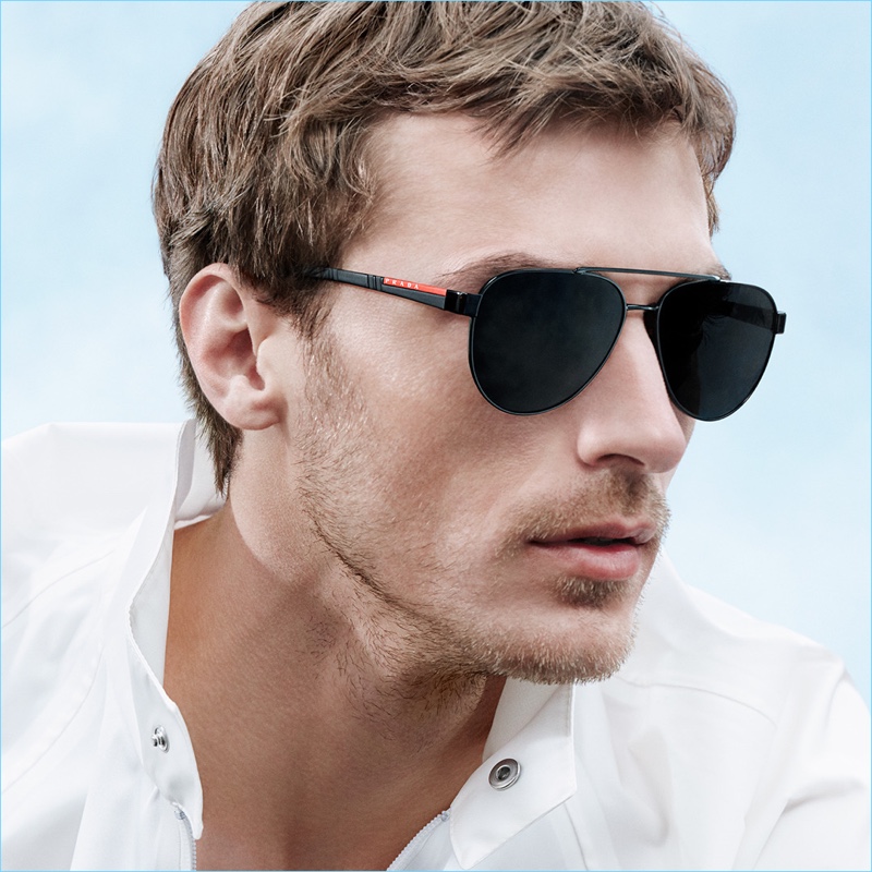 French model Clément Chabernaud sports sunglasses for Prada Linea Rossa's new campaign.