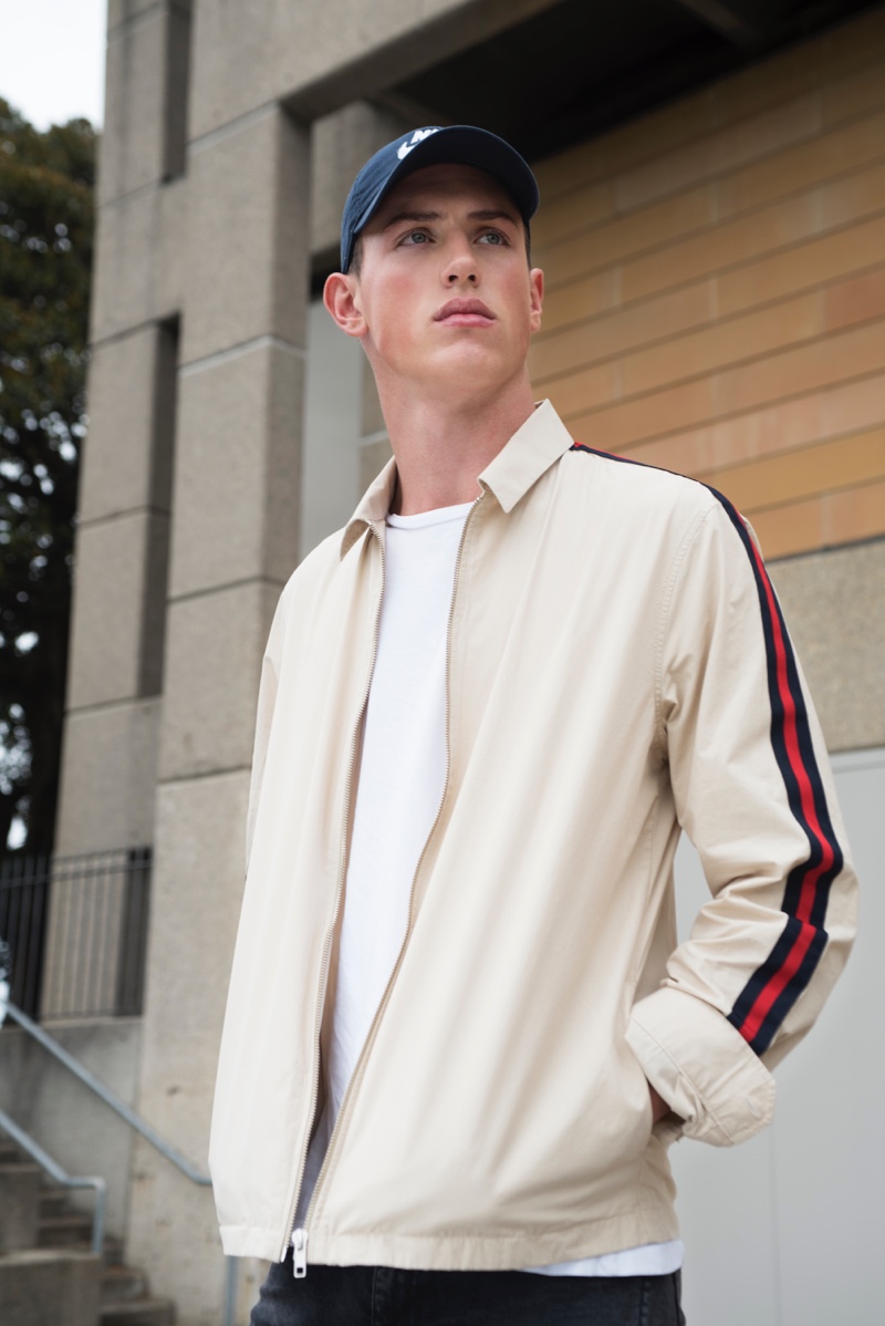 Deakin wears jacket Topman, cap Nike, and t-shirt Calvin Klein.