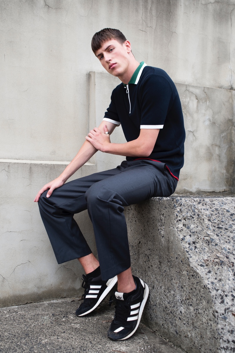 Deakin wears polo Topman, pants Mr. P, and sneakers Adidas.