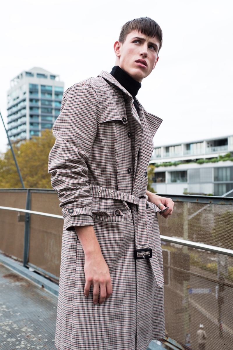 Deakin wears trench Topman and sweater Ksubi.