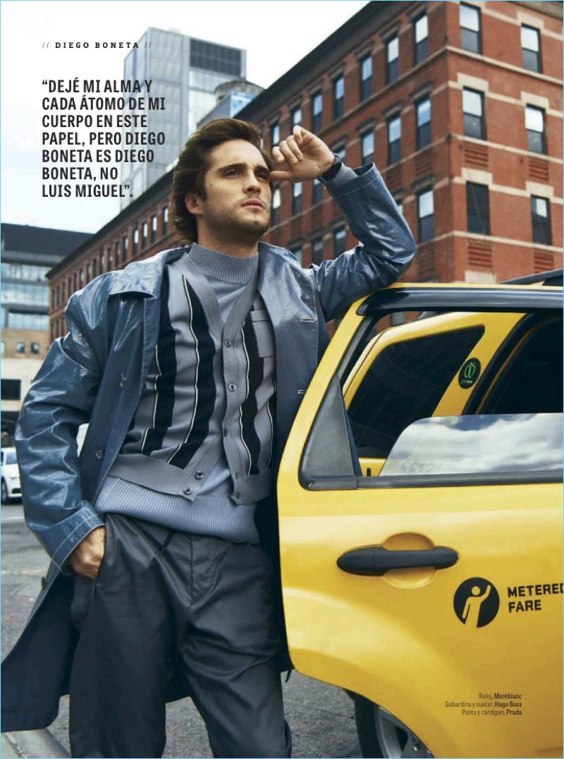 Catching a taxi, Diego Boneta wears a Hugo Boss coat and sweater. He also dons a cardigan and pants by Prada.
