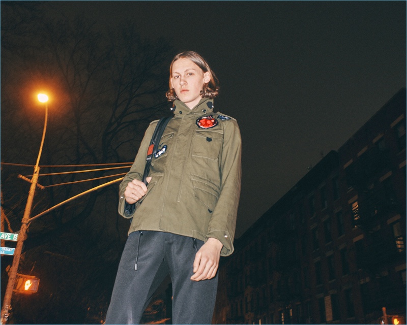 Samuel Wilken sports a parka from the Disney x Coach "A Dark Fairy Tale" collection.