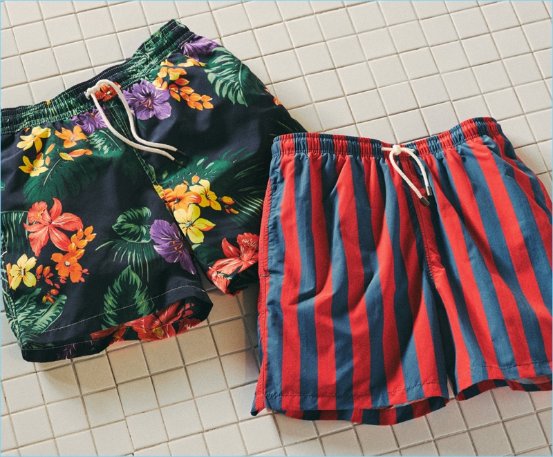 Left to Right: POLO Ralph Lauren tropical jungle traveler swim trunks, Solid & Striped classic striped trunks.
