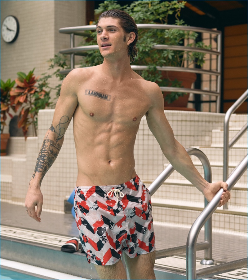 Connecting with East Dane, Jake Lahrman wears Maison Kitsune Venice swim shorts.