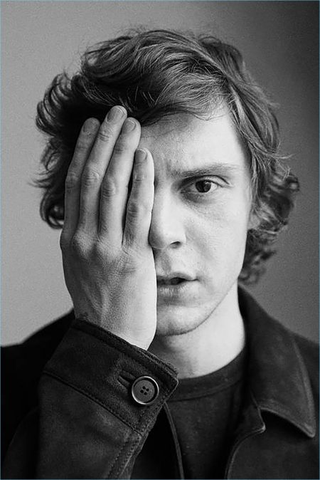 Actor Evan Peters sports a Prada suede blouson jacket and Acne Studios sweatshirt.