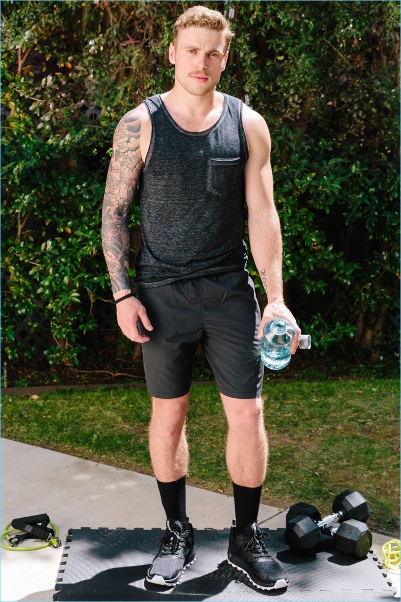 Ready for a workout, Gus Kenworthy sports a H&M tank and elasticized shorts with mesh sneakers.