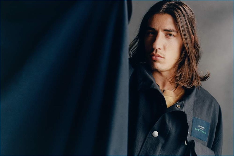 Footballer Héctor Bellerín rocks an oversized Raf Simons jacket with a Balenciaga t-shirt and Wacko Maria necklace.