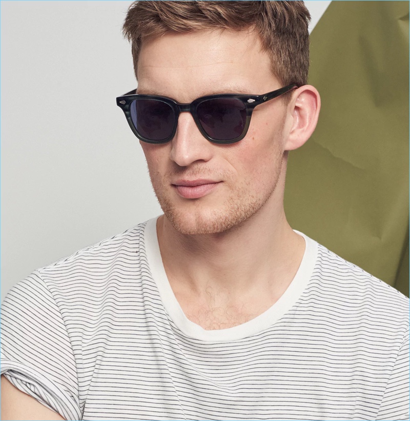 Sunglasses: Bastian Thiery wears J.Crew sunglasses with a striped t-shirt.