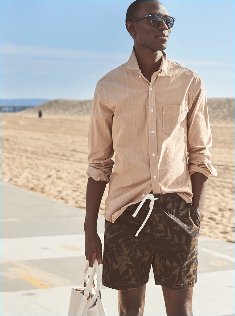 Ready for vacation, Armando Cabral dons J.Crew's stretch dock shorts with a palm camo print.