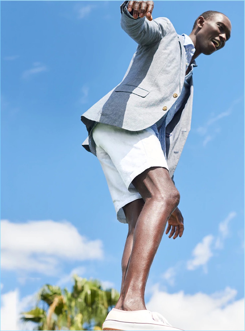 Armando Cabral dons J.Crew's smart 10.5" stretch shorts in stone.