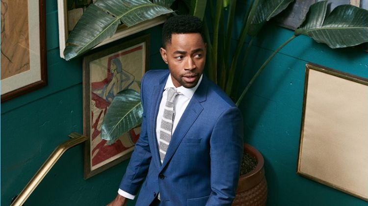Jay Ellis dons a suit, shirt, and tie by BOSS.