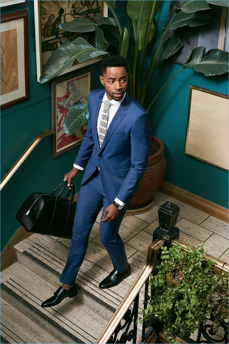 Jay Ellis dons a suit, shirt, and tie by BOSS.