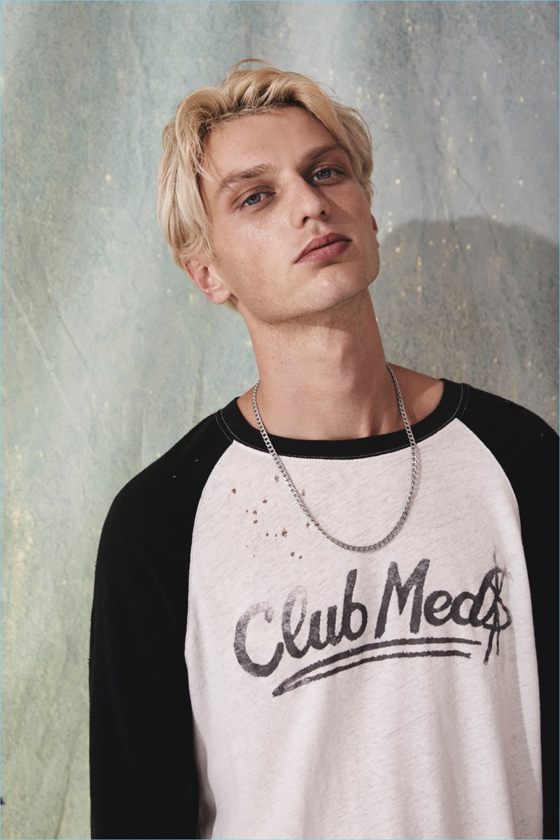 Front and center, Jimmy Freeman wears a distressed baseball tee from Ksubi.