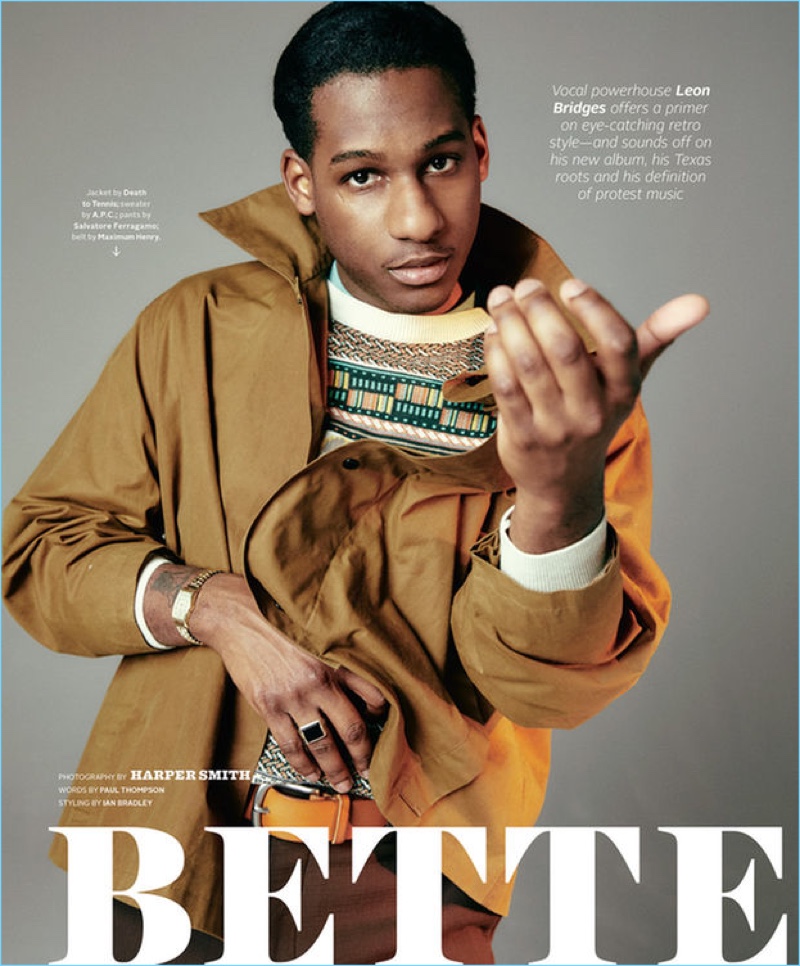 Leon Bridges wears a Death to Tennis jacket with an A.P.C. sweater. He also sports Salvatore Ferragamo pants and a Maximum Henry belt.