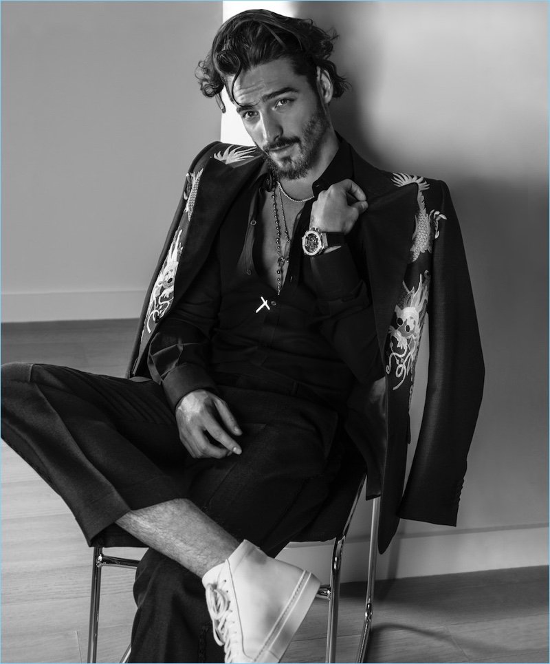 Singer Maluma wears a Gucci suit with a Dolce & Gabbana shirt. He also sports pants by The Kooples with Pierre Hardy shoes and a Hublot watch. » Maluma Covers Haute Living, Talks F.A.M.E. Album & English Music Singer Maluma wears a Gucci suit with a Dolce & Gabbana shirt. He also sports pants by The Kooples with Pierre Hardy shoes and a Hublot watch.