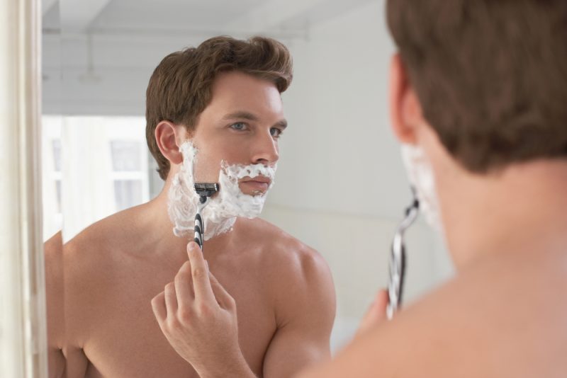 Handsome Man Shaving in Mirror Safety Razor
