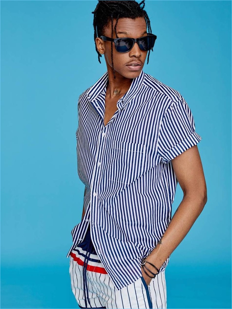 Mixing stripes, Matthew Davidson rocks H&M's short-sleeve shirt with swim shorts.